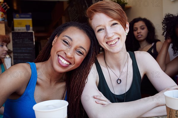 Smiling women in coffee shop