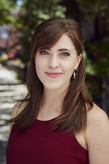 Wind blowing hair of smiling Caucasian woman