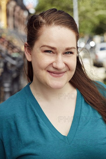 Wind blowing hair of Caucasian woman in city