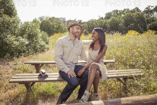 Couple sitting on bench