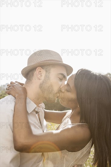 Couple kissing outdoors