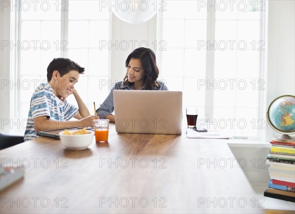 Mother and son having breakfast together