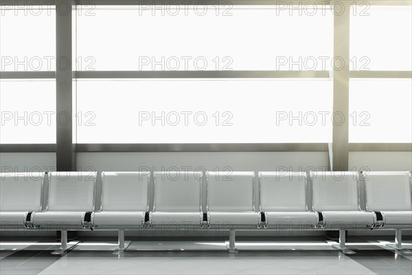 Empty seats in airport lobby