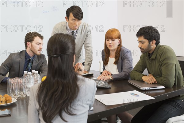 Business people talking in meeting