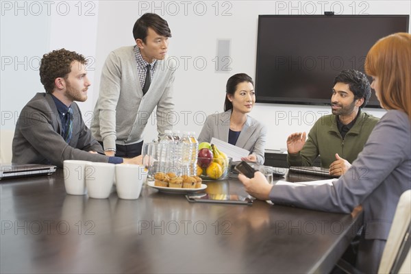 Business people talking in meeting