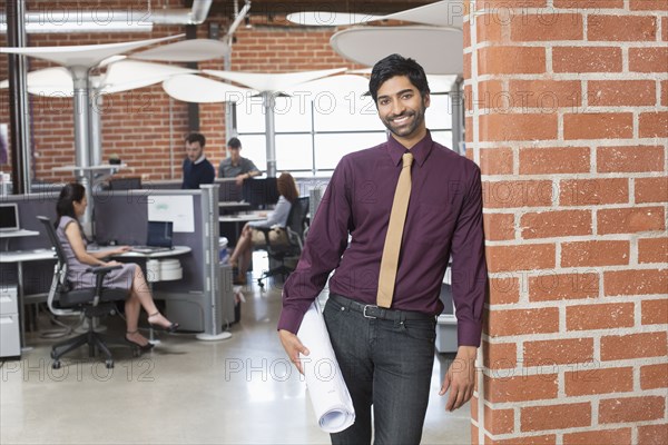 Businessman smiling in office