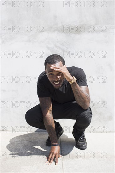 African American man smiling on city street