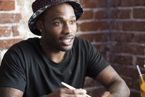 African American man sitting in cafe