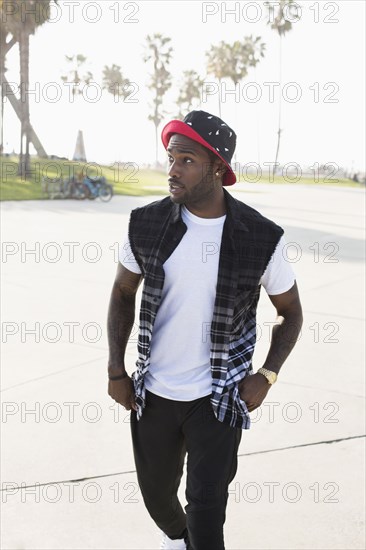 African American man walking on city street