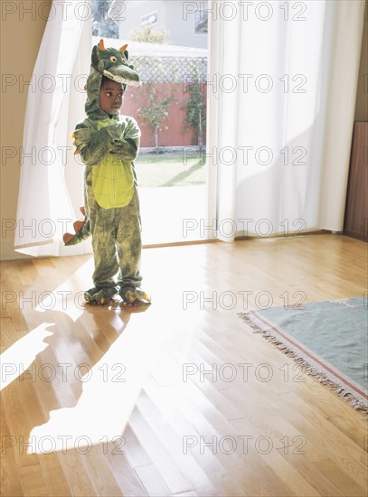 African American girl wearing dragon costume