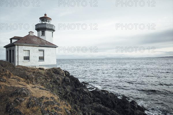 Lighthouse on rocky beach