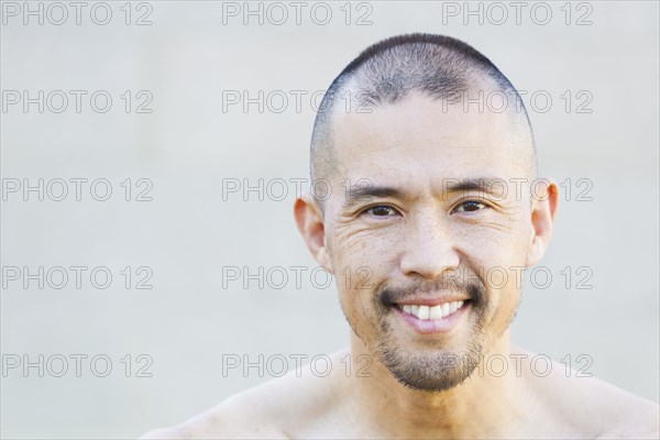 Asian man smiling