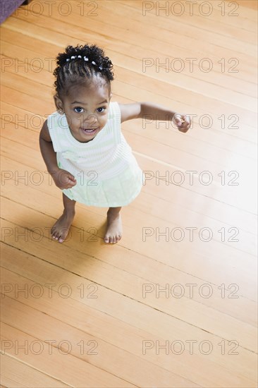 High angle view of young African girl dancing