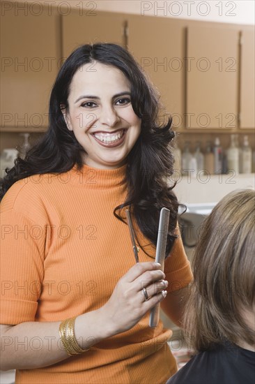 Female hairstylist in salon