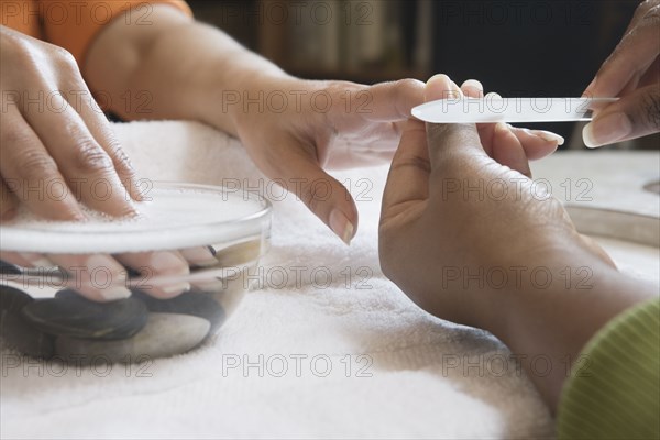 Close up of woman receiving manicure