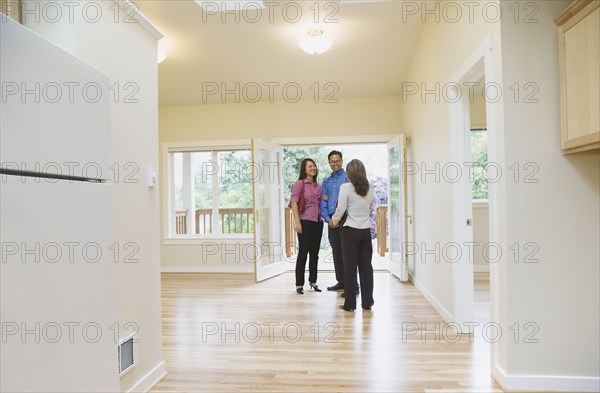 Asian couple looking at new house