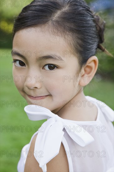 Mixed Race girl looking over shoulder