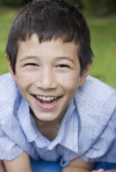 Close up of Asian boy laughing