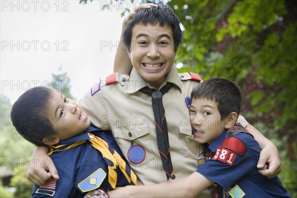 Asian brothers hugging