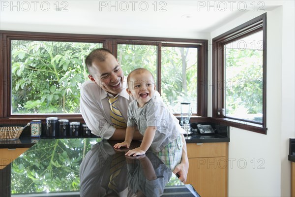 Father and son in kitchen