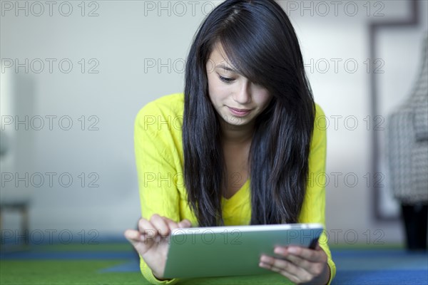 Asian girl using digital tablet