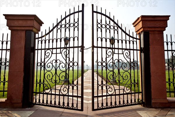 Large iron gates secured with padlock