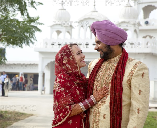 Smiling couple in traditional Indian clothing
