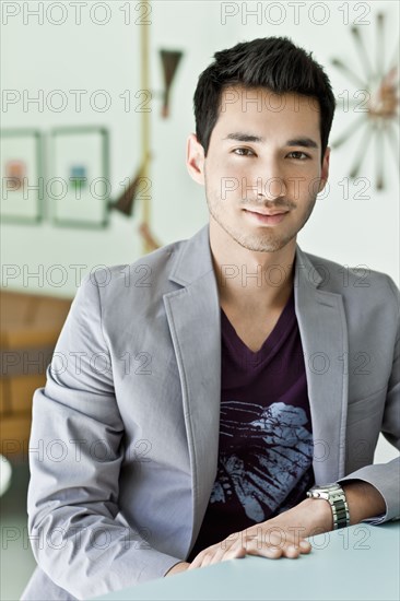 Smiling mixed race man in jacket