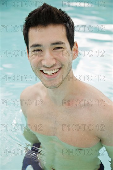 Mixed race man in swimming pool