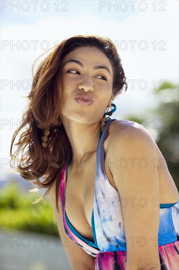 Hispanic woman puckering lips