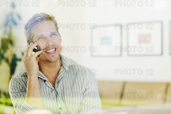 Caucasian man talking on cell phone