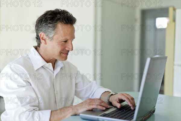 Man typing on laptop