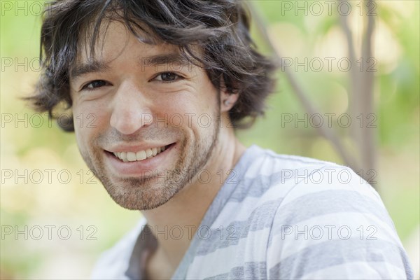 Smiling mixed race man