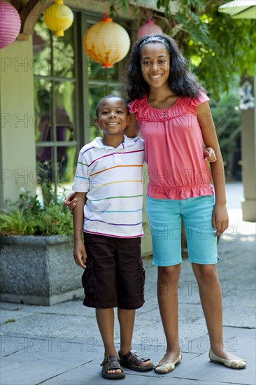 Smiling African American brother and sister