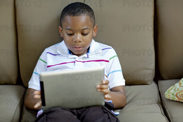 African American boy using digital tablet