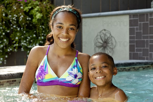 African American children enjoying swimming pool