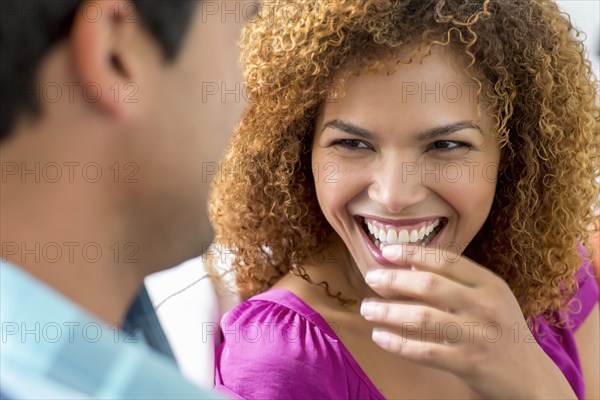 Mixed race couple talking together