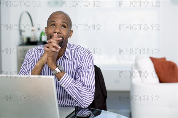 Black businessman thinking