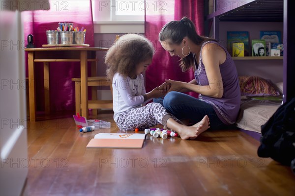 Mother and daughter drawing