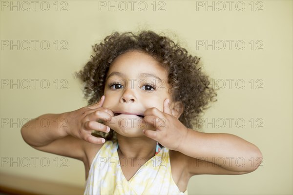 Mixed race girl making silly face