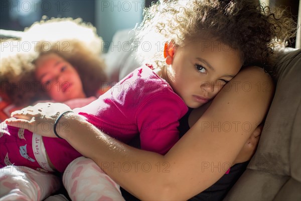 Mother holding daughter