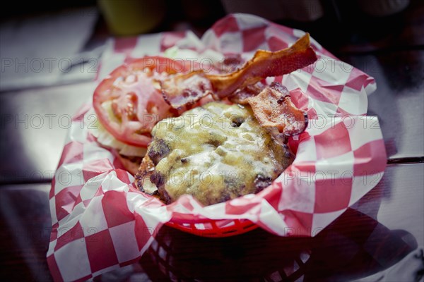 Bacon cheeseburger in basket