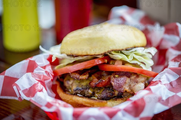 Bacon cheeseburger in basket