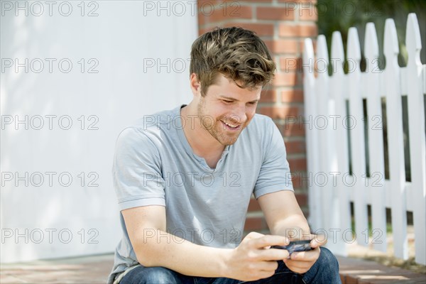 Man using cell phone outdoors