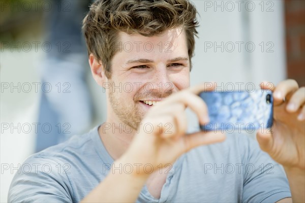 Man using cell phone outdoors