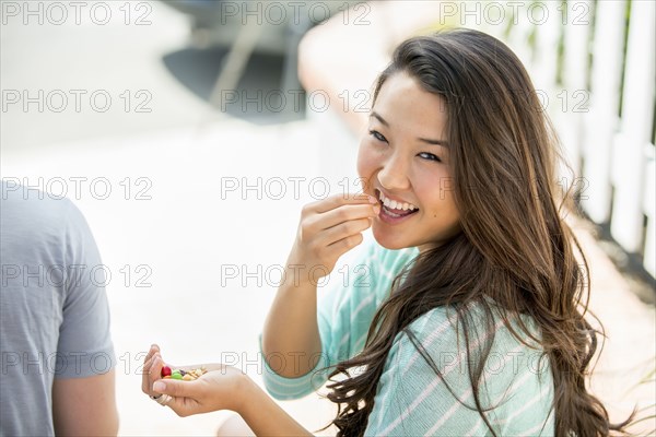 Japanese woman eating outdoors
