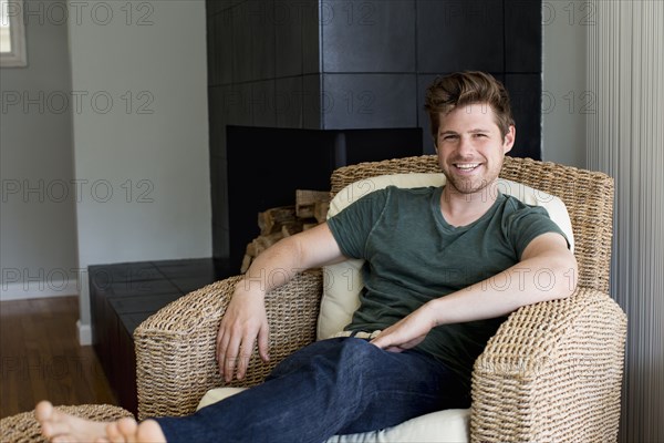 Man smiling in armchair