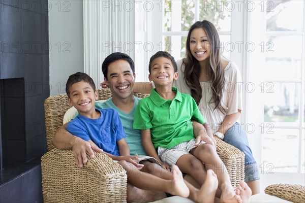 Family posing together in living room