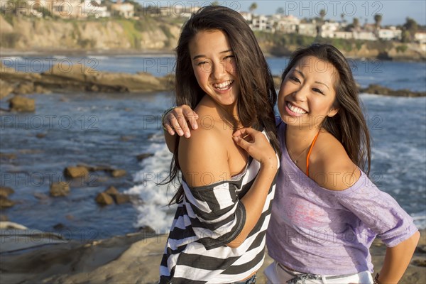 Women smiling on beach