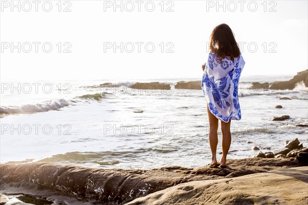 Japanese woman standing on beach